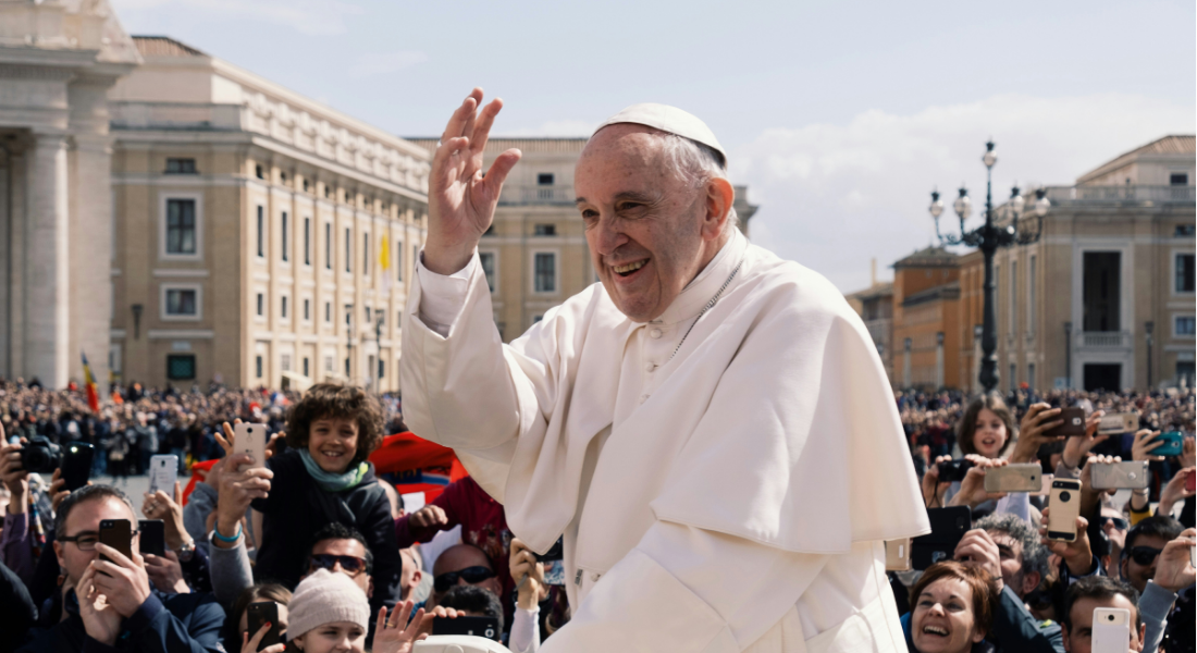 Pope Francis waves at crowd